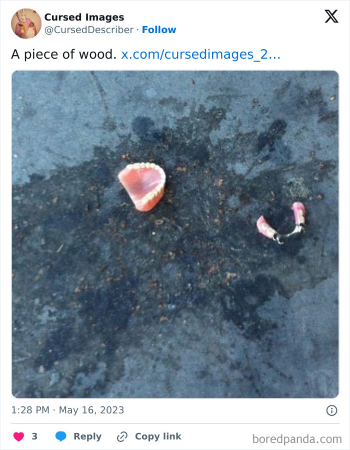 Partial set of dentures lying on a dark stained ground surface in a disturbing cursed image.