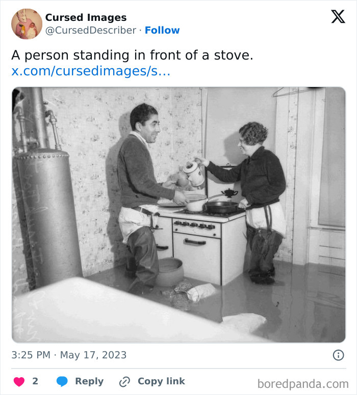 Two people cooking while standing in floodwater inside a kitchen in a disturbing cursed image.