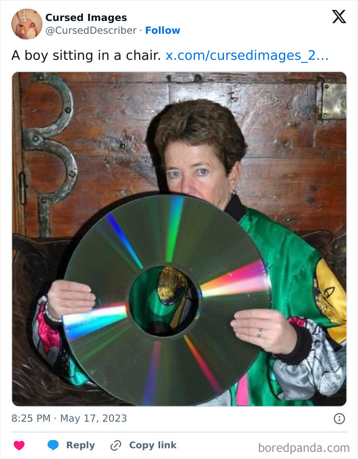 Person holding an unusually large, reflective disc while sitting in a room with wooden wall décor in disturbing cursed images style.