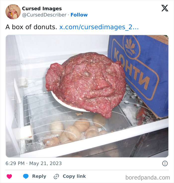Unusual raw meat shaped like a distorted face inside a refrigerator, a disturbing cursed image example.