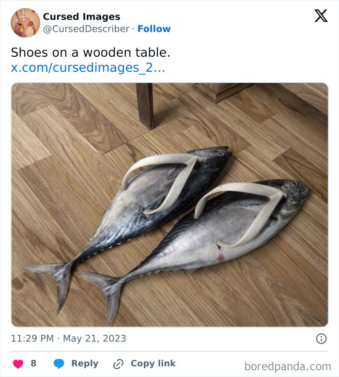 Flip flop sandals made from two large fish placed on a wooden floor, a disturbing cursed image concept.