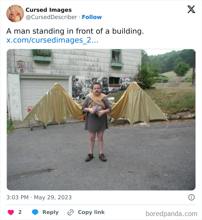 Man wearing large golden wings attached to his back standing in front of a building in a disturbing cursed image.