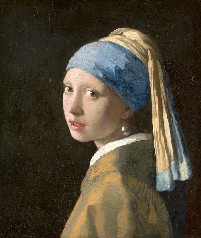 Painting of a young woman with a blue and yellow headscarf and a pearl earring in timeless paintings collection.