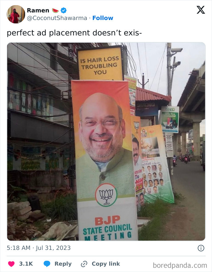 Billboard with a hair loss ad placed above a political banner, illustrating advertising placement fails that made people laugh.