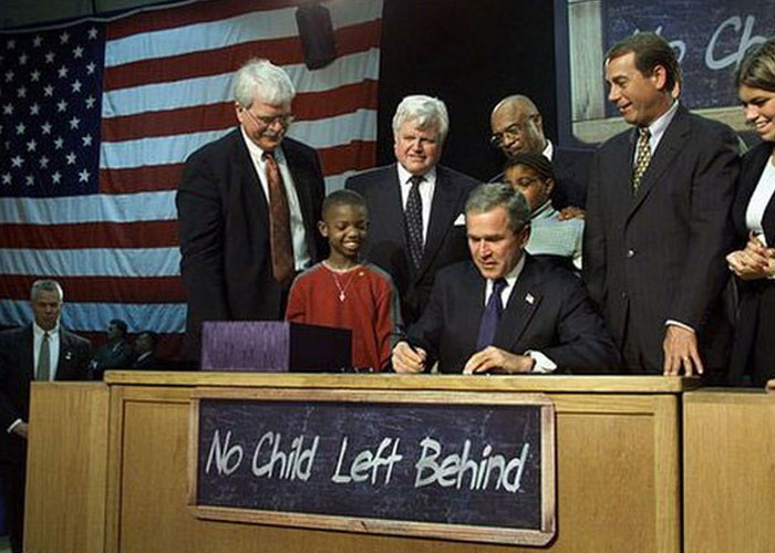 George W. Bush signs No Child Left Behind act, a historical event impacting education and society widely discussed for its damage.