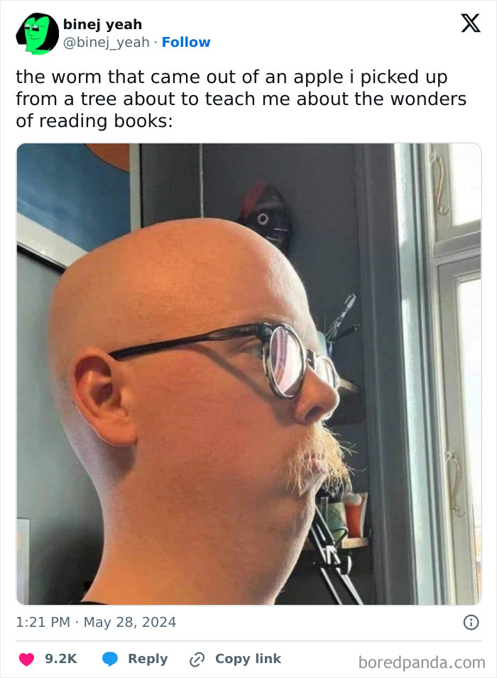 Man with glasses and mustache making a weird face indoors, a perfect example of blessed and cursed weird pics.