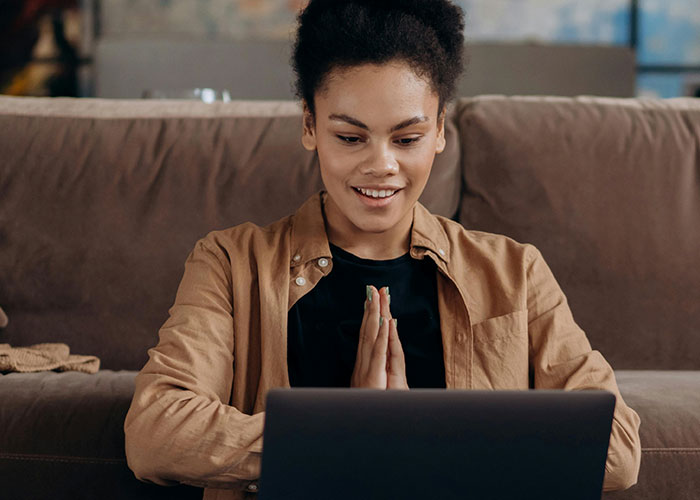 Young man showing clear discomfort during a video call capturing creepy things women do that cross the line.