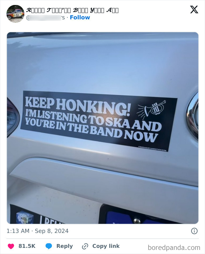 Bumper sticker on white car reads Keep Honking I’m listening to ska with a trumpet illustration in black and white.