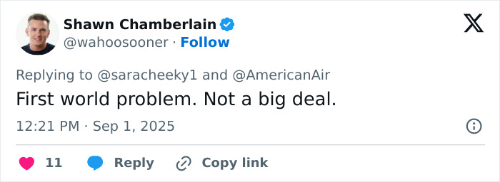 Man in a black shirt responding to a tweet about big breasts discrimination involving a flight attendant and model controversy.