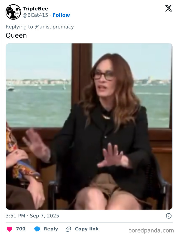 Julia Roberts in black outfit and glasses, gesturing with hands during interview amid Andrew Garfield and Ayo Edebiri snub.