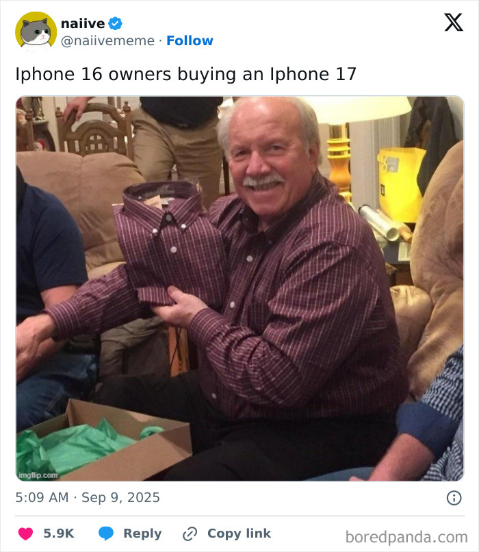 Man holding matching shirt and smiling, illustrating iStove design still continues in Apple iPhone memes.