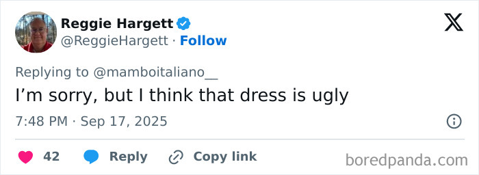 Tweet from Reggie Hargett replying about Melania Trump’s optical illusion dress, expressing a negative opinion on its appearance. Tweet from Reggie Hargett replying about Melania Trump’s optical illusion dress, expressing a negative opinion on its appearance.
