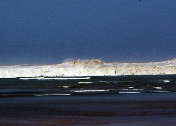 Dark ocean waves crashing under a stormy sky, evoking terrifying true stories hard to believe from nature’s power.