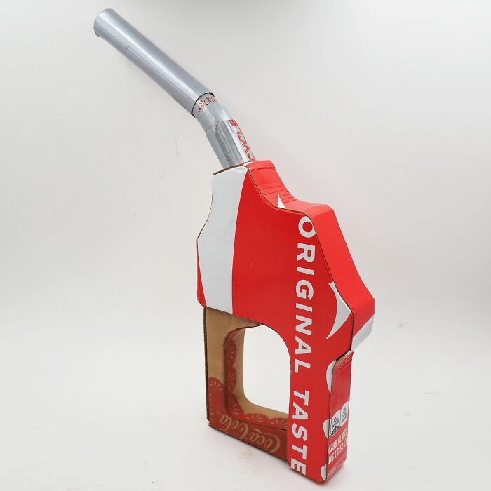 Artistic sculpture made from recycled waste materials, offering witty commentary on modern life and consumer culture.