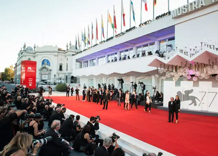 Photographers capture moments on the red carpet at the Venice Film Festival amid news Gal Gadot skips event after petition.