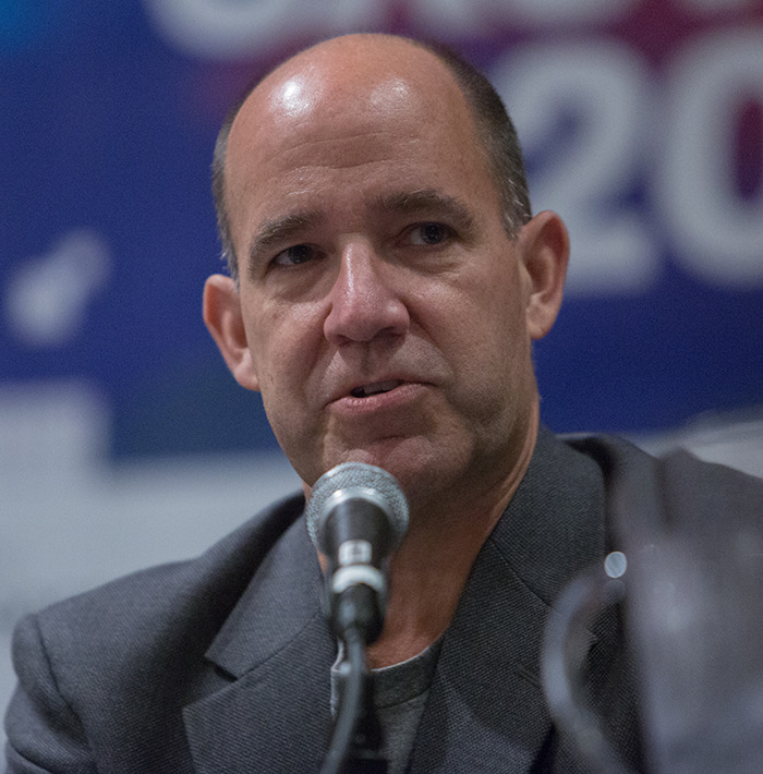 Commentator speaking into microphone during event, linked to unacceptable Charlie Kirk remarks after Utah tragedy firing.