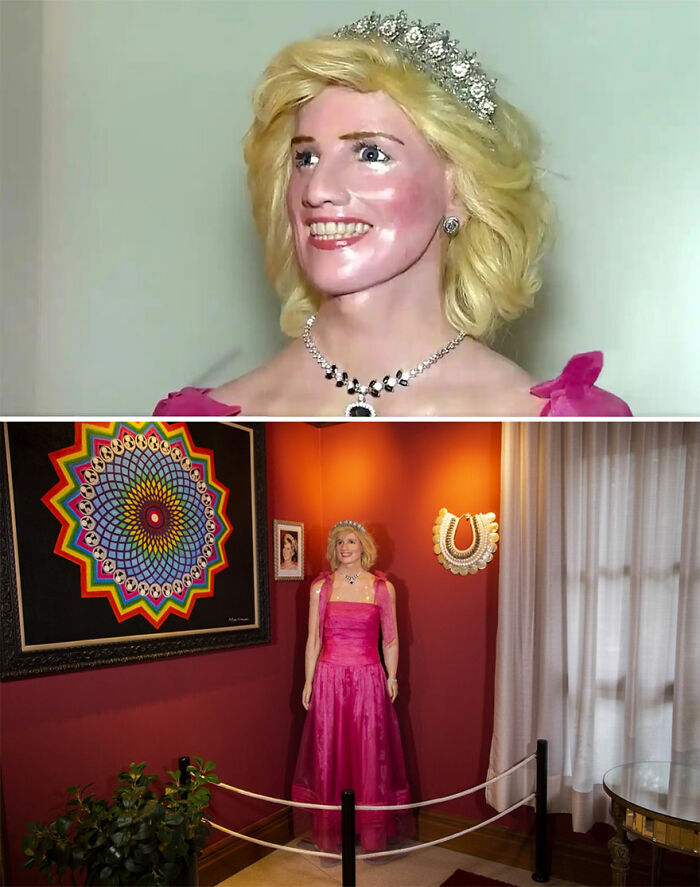 Wax sculpture of a famous figure in a pink dress with a tiara displayed in an art gallery setting.