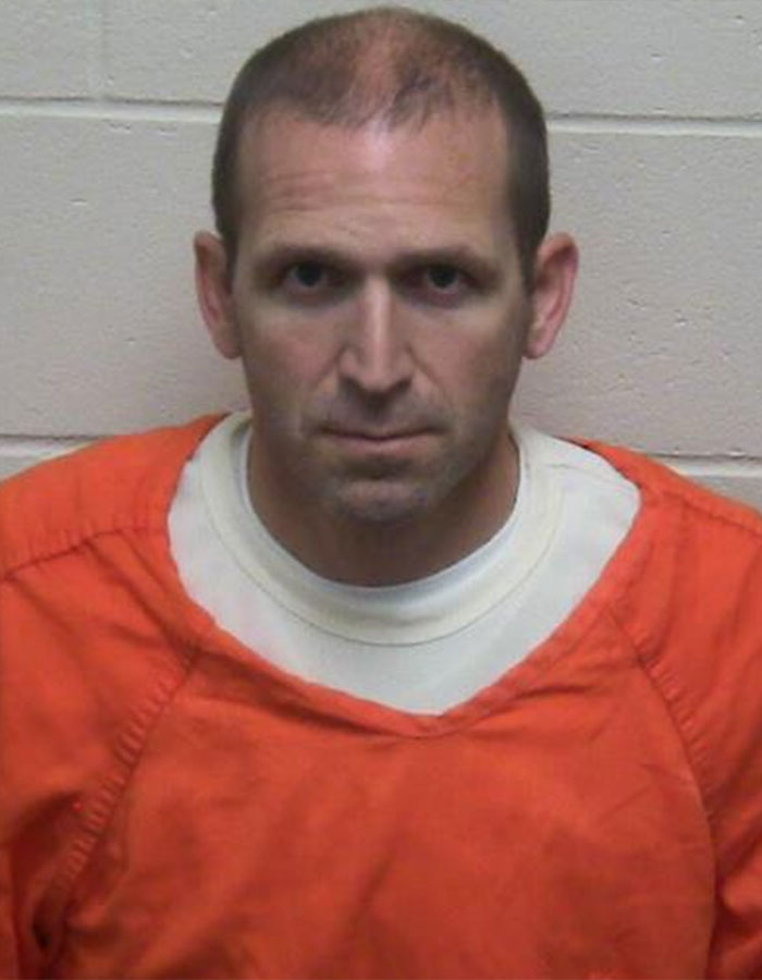 Mugshot of a man in an orange prison jumpsuit related to husband's final texts to wife revealed story.