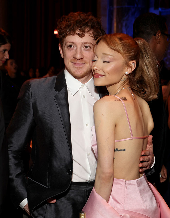 Ethan Slater and Ariana Grande posing together at an event amid breakup rumors and public attention. Ethan Slater and Ariana Grande posing together at an event amid breakup rumors and public attention.