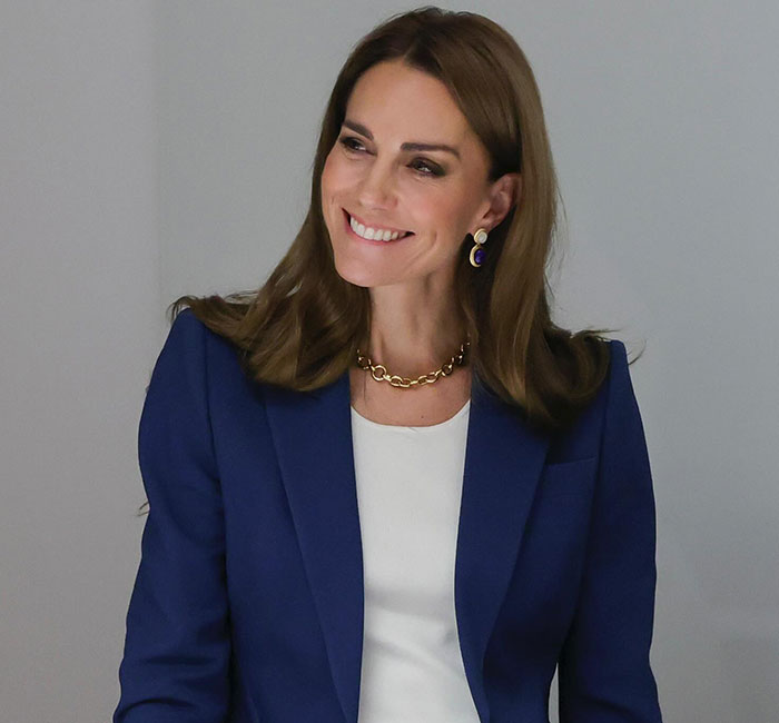 Kate Middleton warmly saying goodbye to King Charles with a kiss on the cheek after royal funeral event.