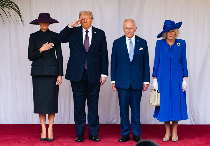Melania Trump standing without curtsying beside Donald Trump and British royals during state visit event. Melania Trump standing without curtsying beside Donald Trump and British royals during state visit event.