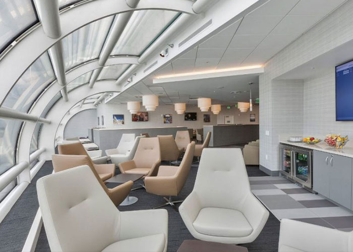 Airport lounge with modern seating and large windows, highlighting breastfeeding stigma and health risks awareness.