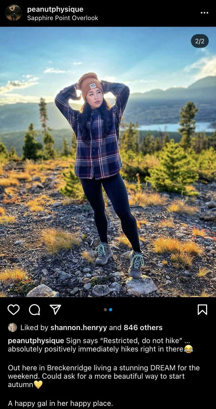 Woman hiking outdoors in autumn wearing hiking boots and casual fitness clothes, embracing active gym lifestyle.