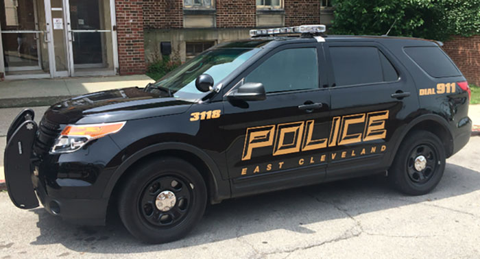 Black East Cleveland police SUV parked on a street, related to cop opens fire on teens porta-potty prank incident.