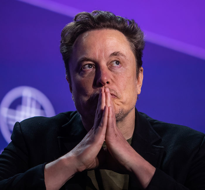 Elon Musk in deep thought with hands pressed, accused of hypocrisy after reposting Erika Kirk&rsquo;s viral church message
