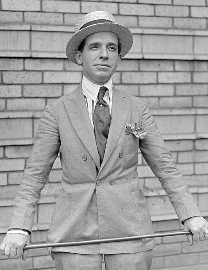 Vintage black and white photo of a man in a suit and hat, representing famous fraud cases from history.