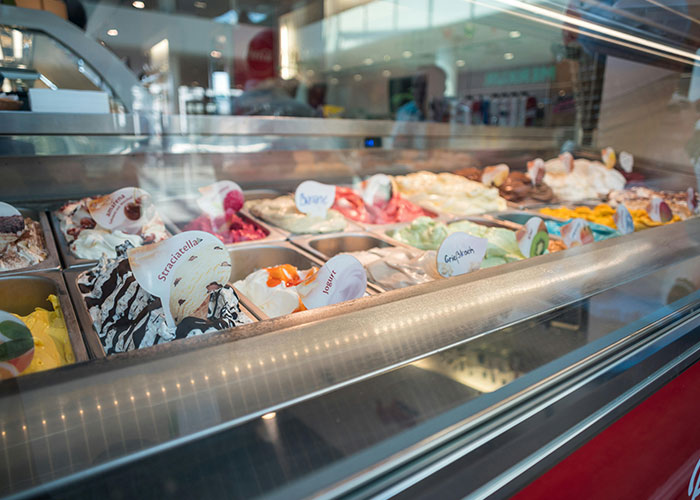 Gelato display in a shop showcasing various flavors as a visual metaphor for incredible coincidences that sound fake but are true.