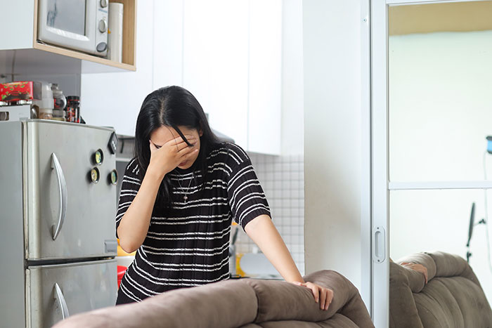 Woman in kitchen overwhelmed and distressed, reflecting on late sister’s dying wish and unexpected life challenges. Woman in kitchen overwhelmed and distressed, reflecting on late sister’s dying wish and unexpected life challenges.