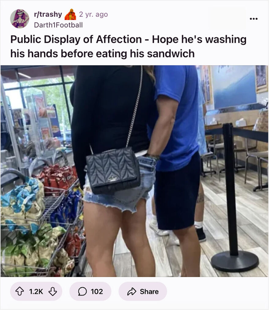 Couple displaying affection in public with one person&rsquo;s hand awkwardly placed, highlighting red flags masquerading as green lights.