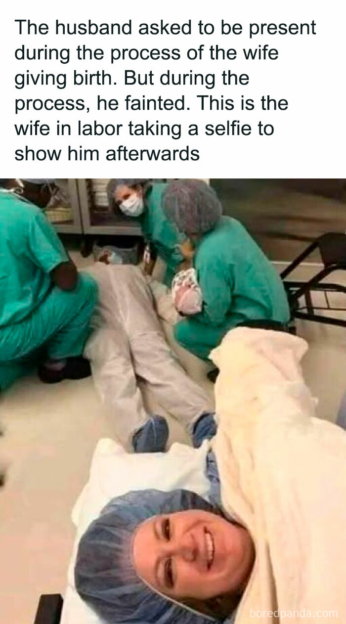 Wife in labor takes a selfie after husband faints during childbirth, surrounded by medical staff in scrubs. EMT humor scene.