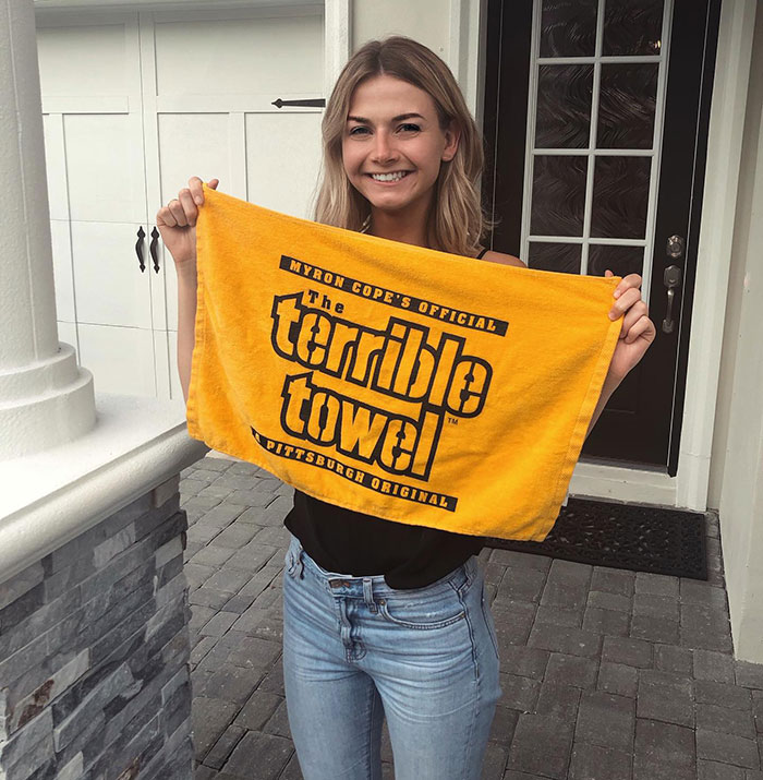Young woman holding a yellow towel, with Brooklyn midwife&rsquo;s dice game club safety concerns for non-white women topic.
