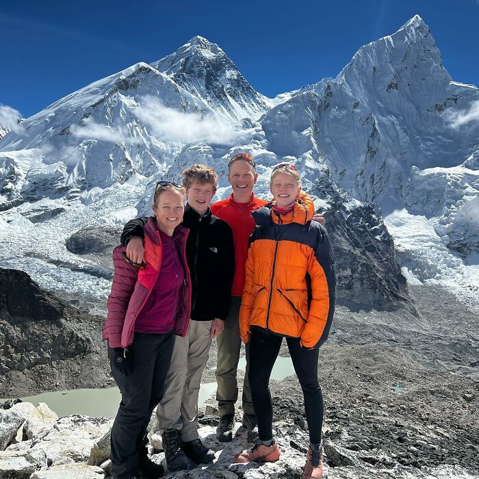 Group of climbers posing near snowy Everest base, highlighting risks of severe injuries after Everest climb controversy. Group of climbers posing near snowy Everest base, highlighting risks of severe injuries after Everest climb controversy.