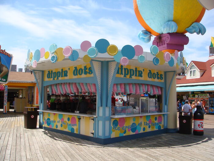 Dippin' dots ice cream stand with colorful decorations on a sunny day, showcasing the next big thing that totally flopped.