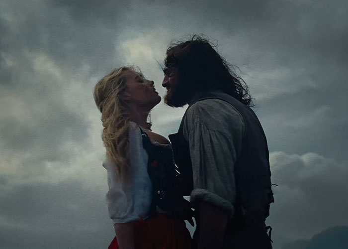 Margot Robbie and Jacob Elordi in a dark moody scene from Wuthering Heights teaser set in the 1800s.