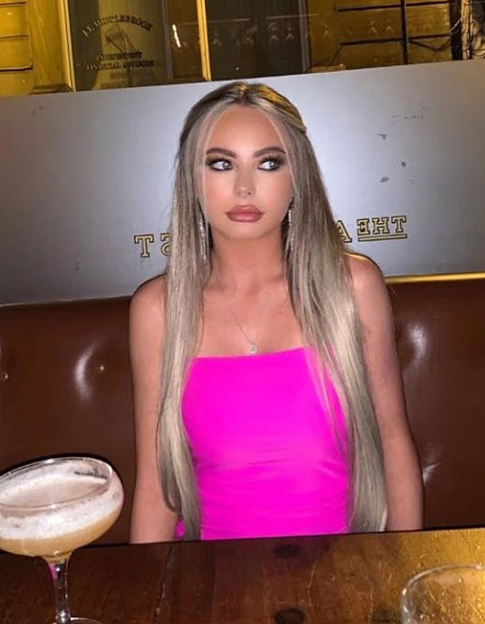 Young woman in a bright pink dress sitting in a restaurant, related to law student jailed for life in Dubai news. Young woman in a bright pink dress sitting in a restaurant, related to law student jailed for life in Dubai news.