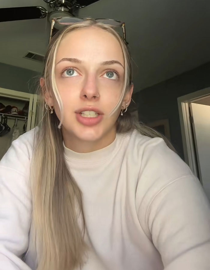 Young woman speaking on camera in a casual room setting, sharing juror break silence after grandma's court meltdown viral story.