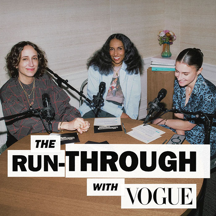 Three women sitting at a table with microphones recording a podcast about Anna Wintour and The Devil Wears Prada.