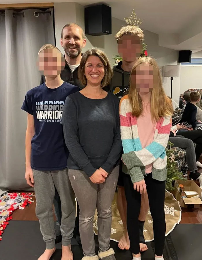 Family posing indoors near Christmas tree, illustrating husband's final texts to wife revealed after faking his own passing.