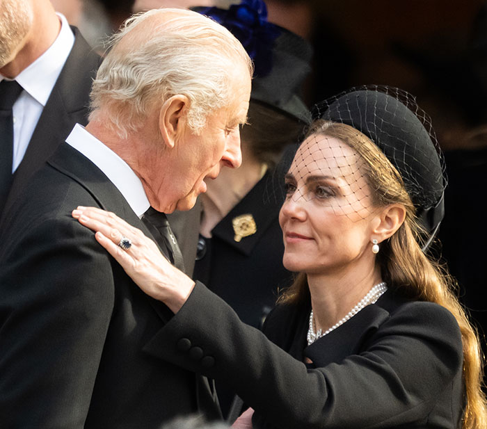 Kate Middleton warmly saying goodbye to King Charles with a kiss on the cheek after the royal funeral ceremony
