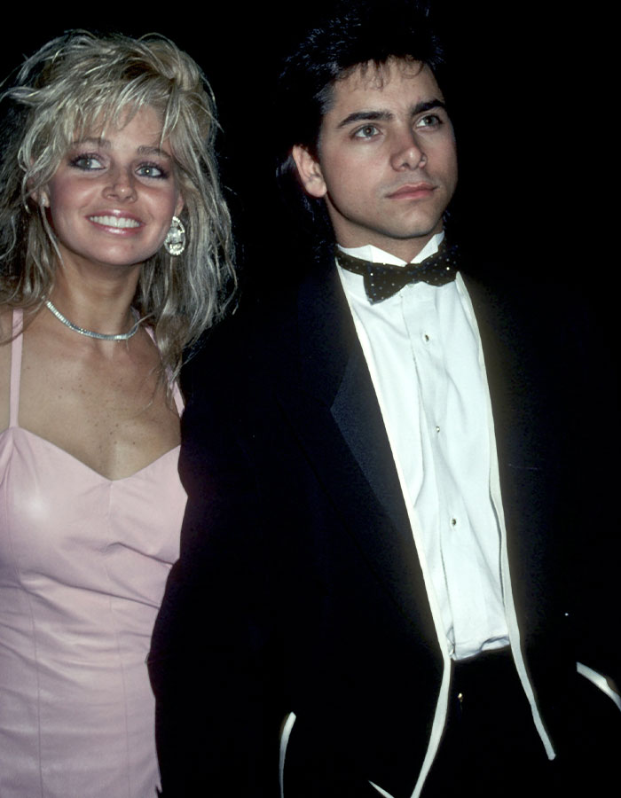 Blonde woman in pink dress and man in tuxedo attending an event, representing raw and unfiltered confessions celebs shared.