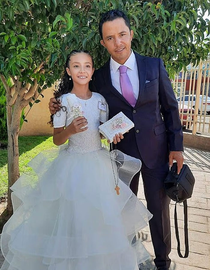 Young girl in white dress standing with man in suit outdoors relating to surgeon breast enlargement case.