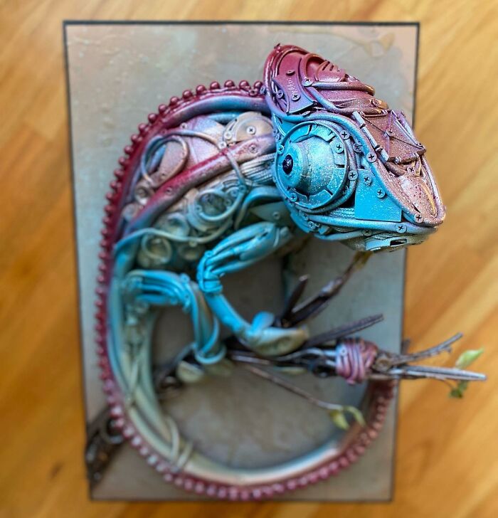 Intricate animal sculpture made from trash materials, showcasing vibrant colors and detailed recycled art craftsmanship.