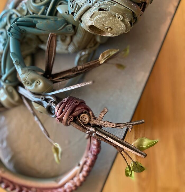 Intricate animal sculpture made from trash materials, showcasing vibrant colors and detailed recycled art craftsmanship.