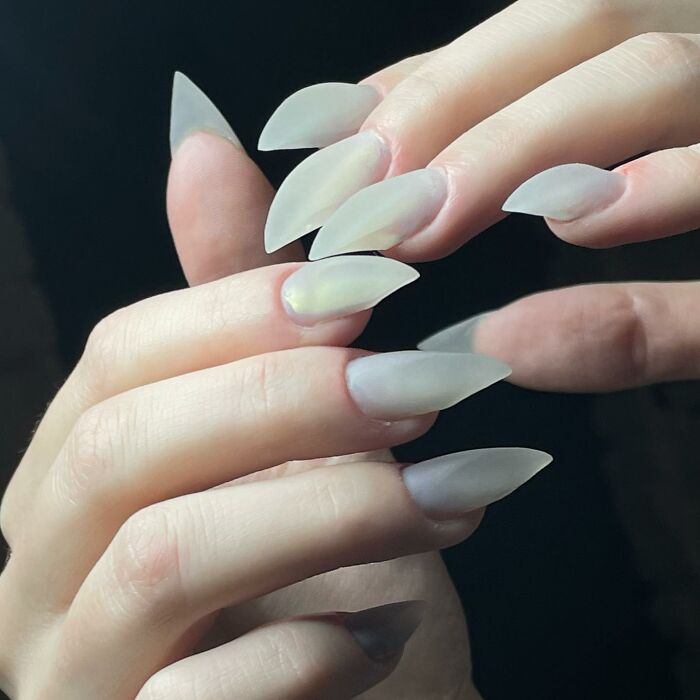 Close-up of long matte pointed nails showcasing one of the 50 nail designs that break all the rules and look amazing.