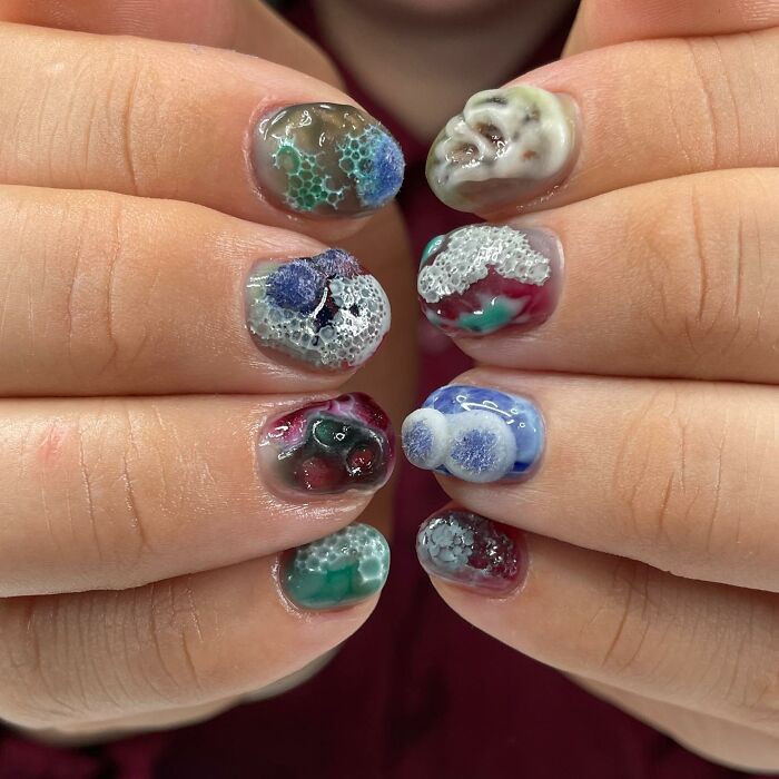 Unique nail designs featuring 3D textures and bold colors showing creative and rule-breaking nail art styles.