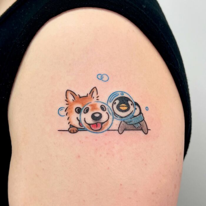 Cute animal tattoo on arm featuring a dog, fox, and penguin with bubbles by Korean artist Buoy